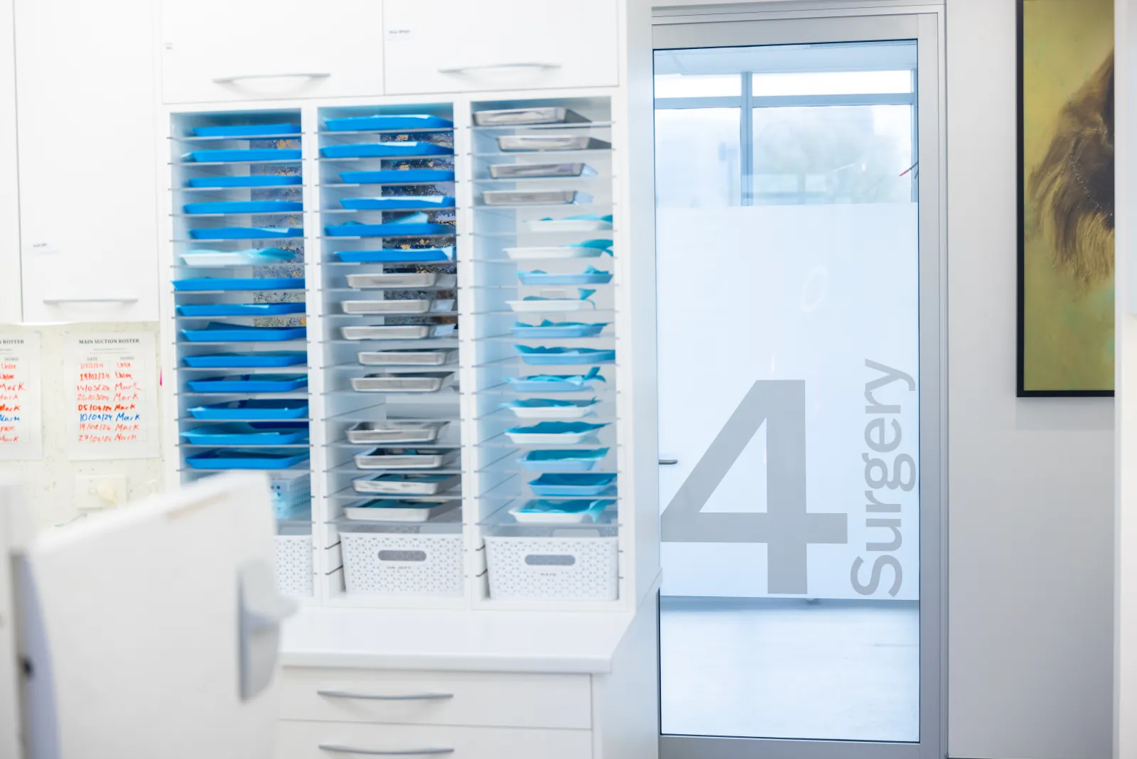 Prepared instrument trays outside a clinic surgery room